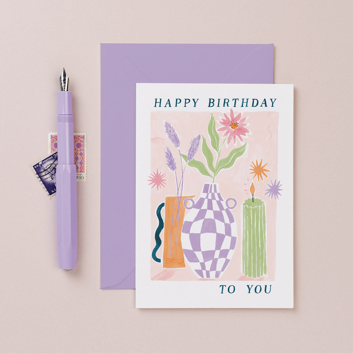A stylish flower and candle illustration on a birthday card from the female birthday card collection at Sister Paper Co.