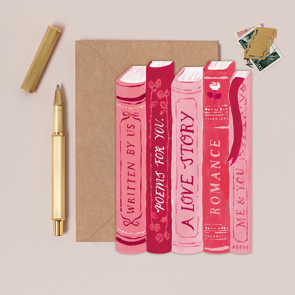 Book-stack love story card design shown close up