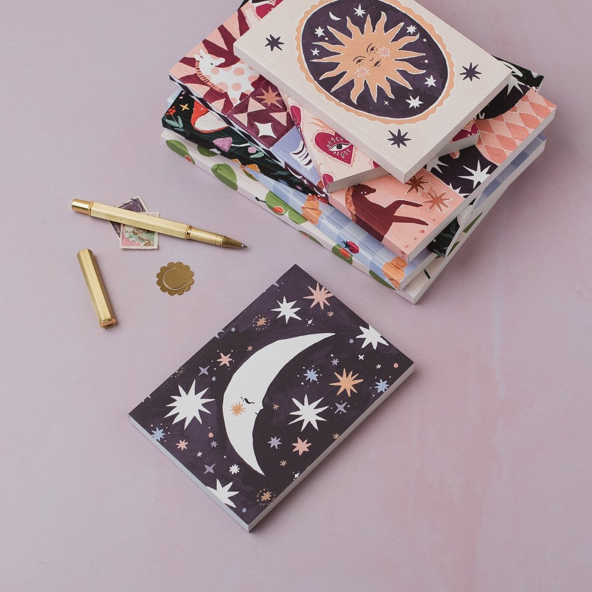 Sleeping moon pocket notebook styled with props