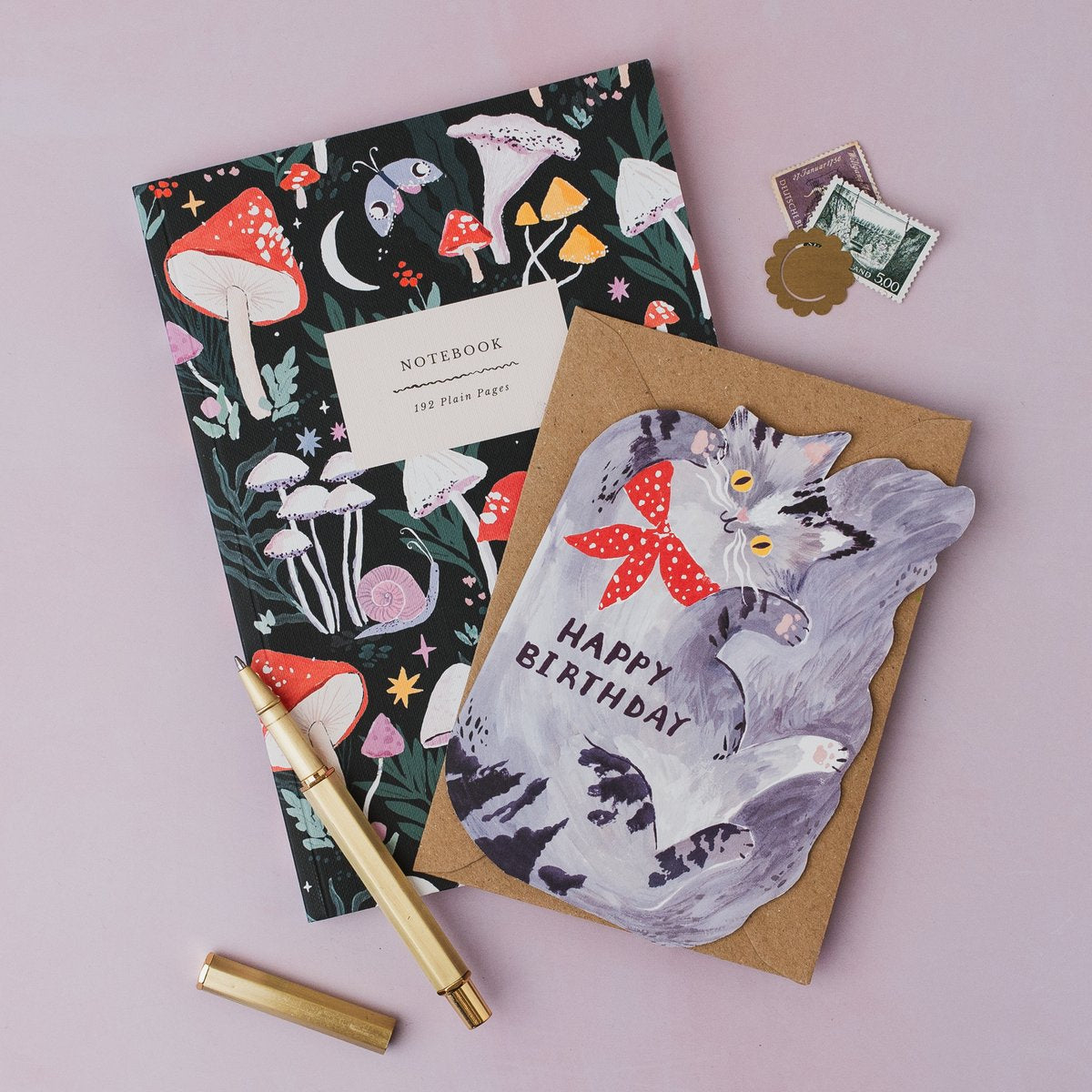 Sister Paper Co cat birthday card and mushrooms notebook styled together