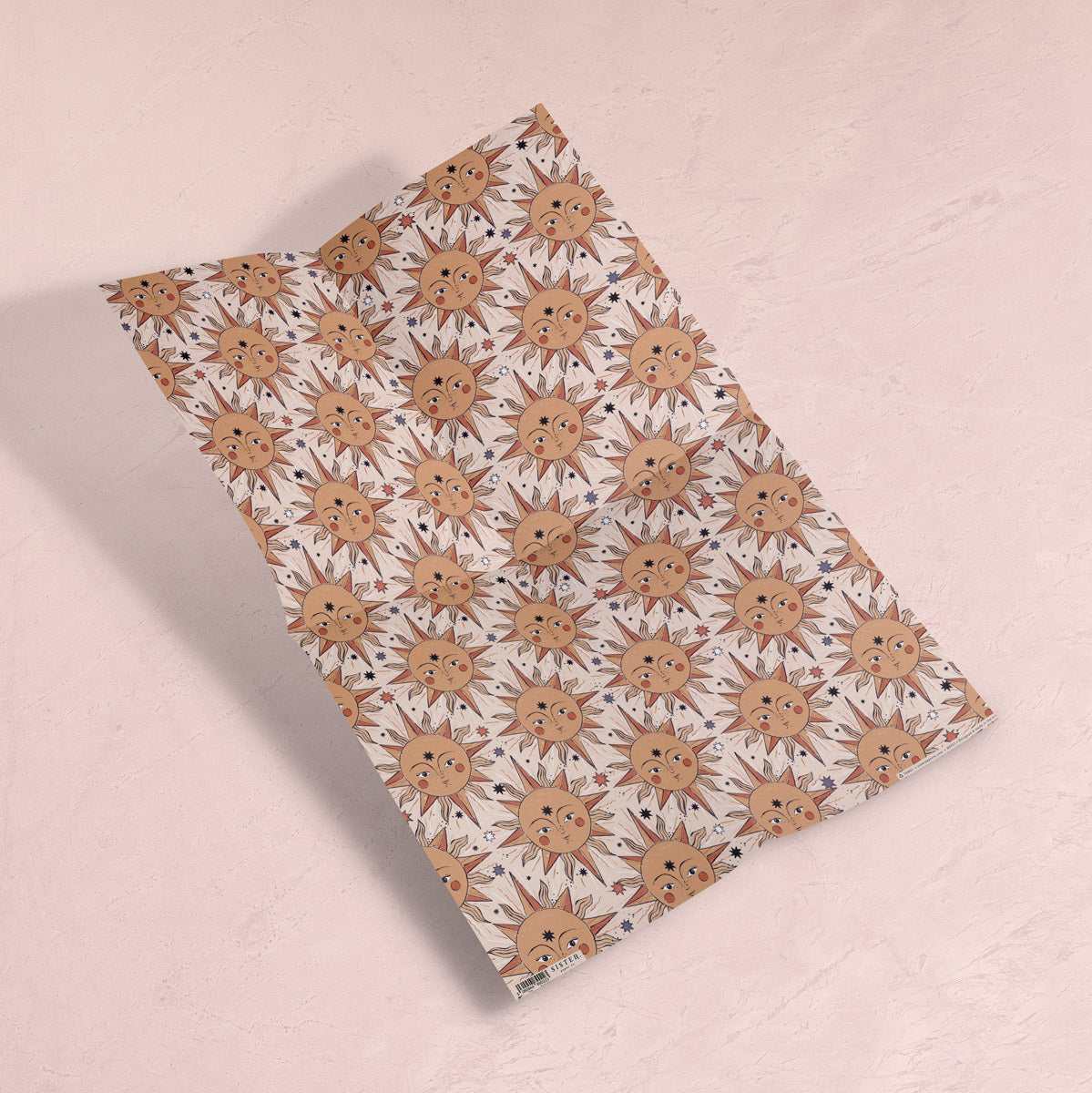 A Tarot-inspired sun print on wrapping paper from the female birthday wrapping paper collection at Sister Paper Co.