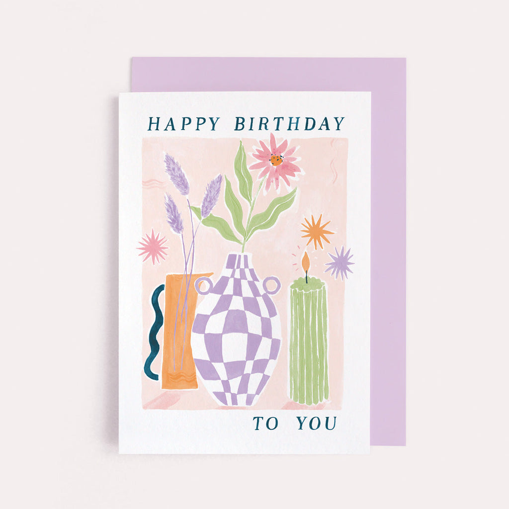 A stylish flower and candle illustration on a birthday card from the female birthday card collection at Sister Paper Co.