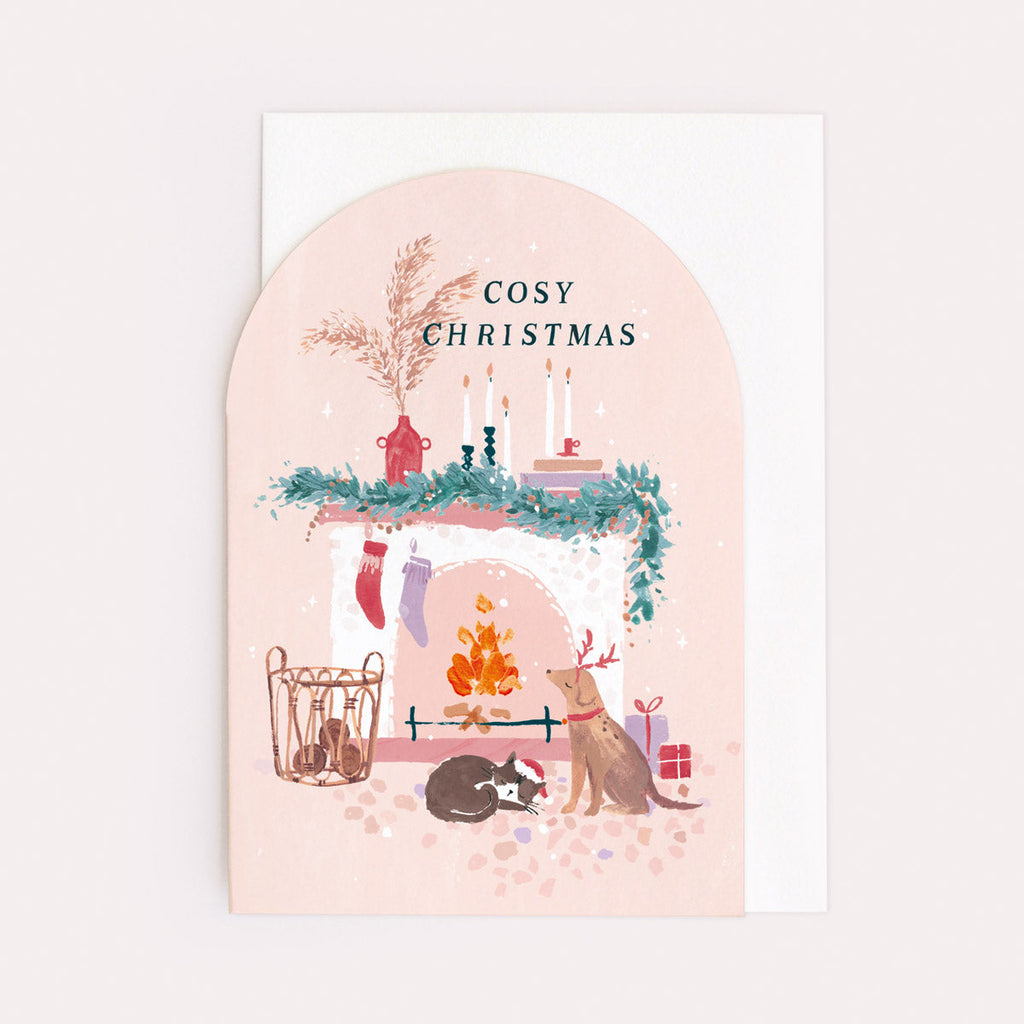 A christmas card featuring a cosy fireplace, dog and cat from the Nevada holiday card collection at Sister Paper Co.