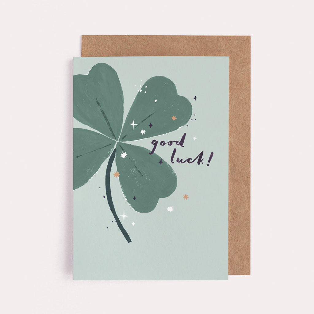 A four leaf clover on a modern good luck card from the card collection at Sister Paper Co.