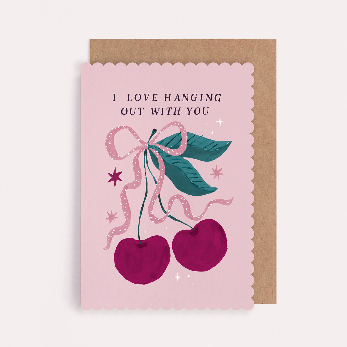 Scallop-edged cherry anniversary and Valentine's card with a pink bow and the caption 'I Love Hanging Out With You'