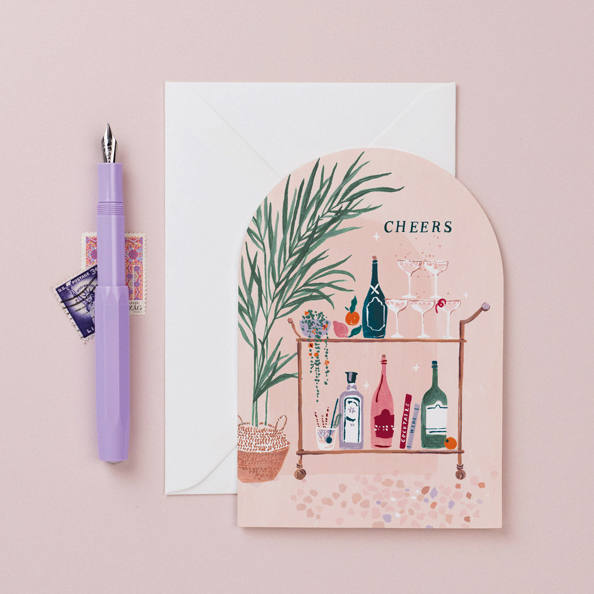 A birthday card with cheers lettering and bar cart with gin illustration on a birthday card from the female birthday card collection at Sister Paper Co.