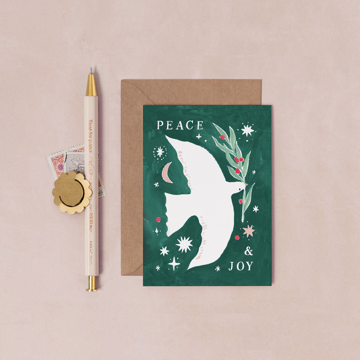 A mini Christmas card with an illustrated peace dove from the mini Christmas card collection at Sister Paper Co.