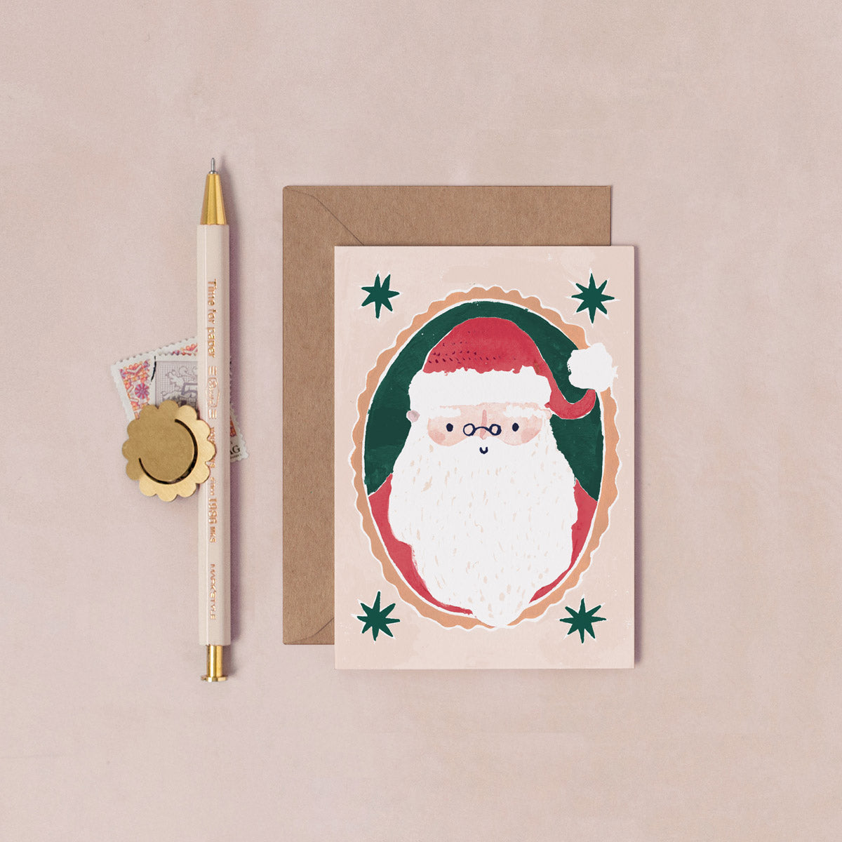 A mini Christmas card with an illustrated festive santa from the mini Christmas card collection at Sister Paper Co.