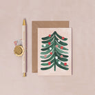 A mini Christmas card with an illustrated Christmas tree from the mini Christmas card collection at Sister Paper Co.