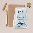 Funny Father's day card with an upturned glass trapping a spider with the caption 'thanks for catching all the spiders'