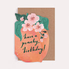 Peach-shaped fruity birthday card with blossoms and the caption 'Have A Peachy Birthday'