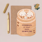 Dumpling new baby card design shown close up
