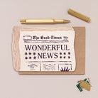 Newspaper congratulations card design shown close up