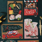 Gingerbread bakery cart Christmas card on a dark teal background with cheeseboard, martini and Driving Home for Christmas shaped cards