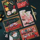 Driving Home for Christmas car shaped card on a dark teal background with cheeseboard, martini and Christmas bus cards