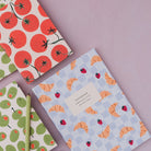 Croissant Cafe notebook styled on a desk