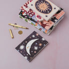 Sleeping moon pocket notebook styled with props