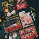 Tini Bit Festive martini Christmas card on a dark teal background with cheeseboard, gingerbread cart, Driving Home for Christmas and Christmas bus cards