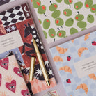 Sister Paper Co notebooks and pocket notebooks in a flat lay