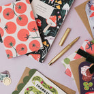 Sister Paper Co notebooks and gift wrap styled together
