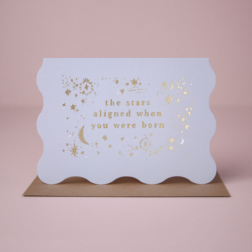 A birthday card featuring luxe stamped gold foil details from the Cosmique range of greeting cards from Sister Paper Co.