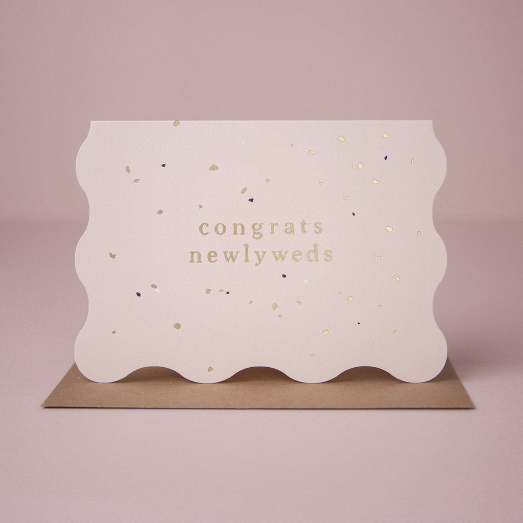 A wedding card featuring luxe stamped gold foil details from the Cosmique range of greeting cards from Sister Paper Co.