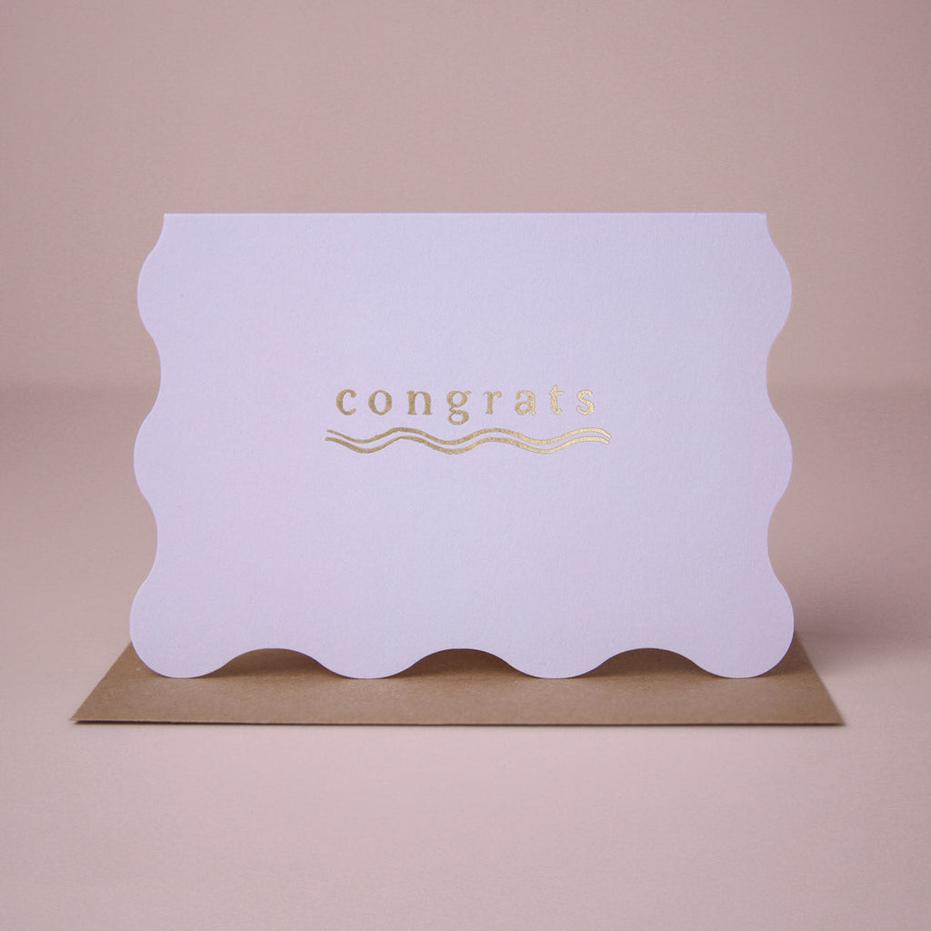 A congratulations card featuring luxe stamped gold foil details from the Cosmique range of greeting cards from Sister Paper Co.