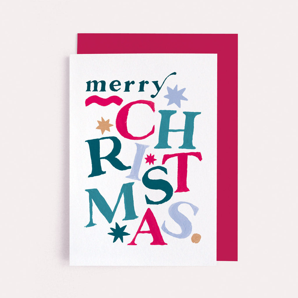 Rainbow lettering on a Christmas card from the colourful, rainbow Christmas card collection at Sister Paper Co.